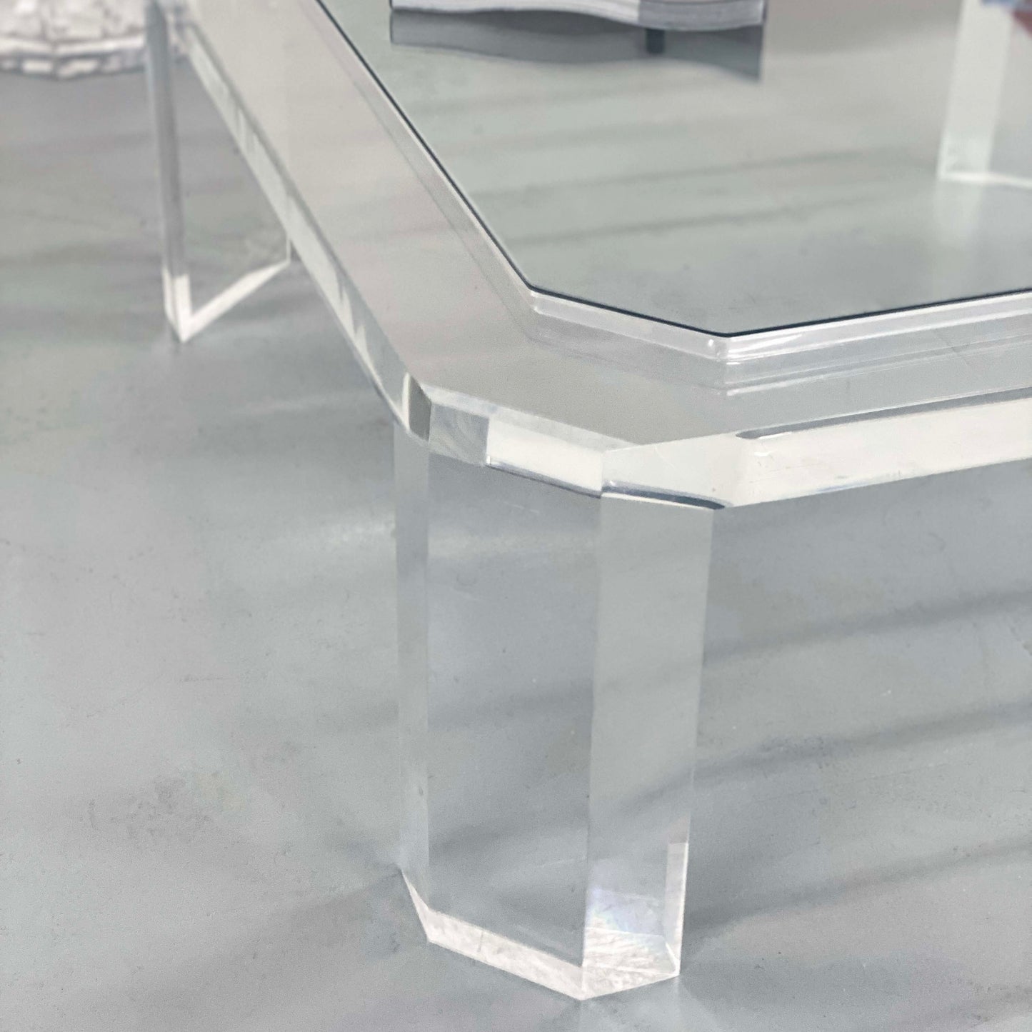 a clear glass table with a lucite base in Portland Oregon