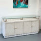 TESSELLATED MACTAN STONE AND GLASS TOP CREDENZA